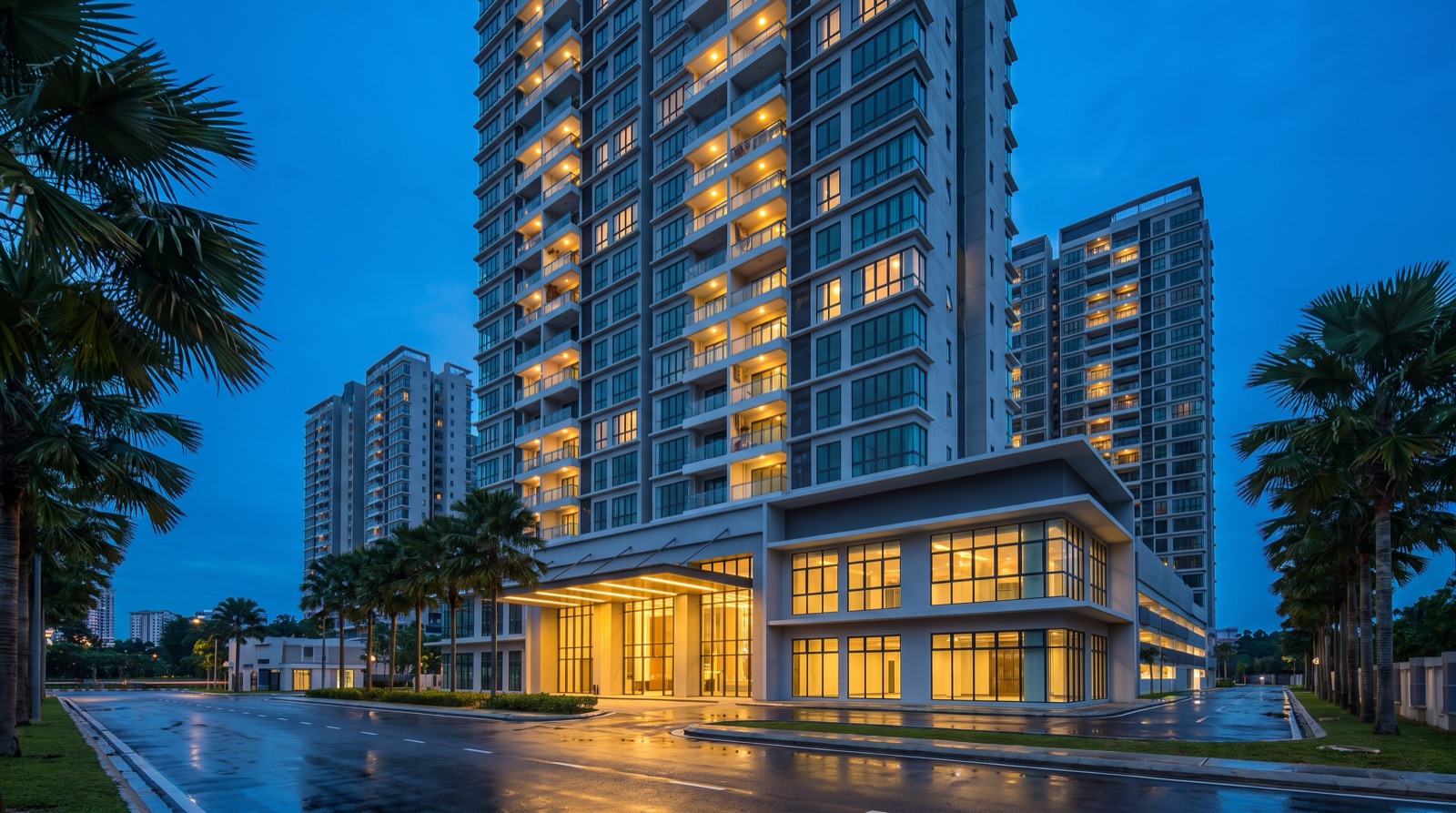 Malaysian condominium tower at dusk with lit windows, the kind of block where smart home integration with property management works unit by unit