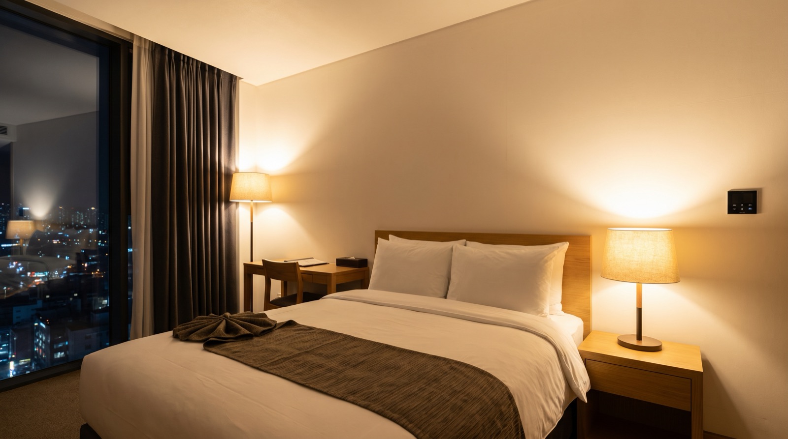 Wall-mounted smart control panel beside the bed in a Malaysian hotel room or serviced apartment for lights, aircon and curtains